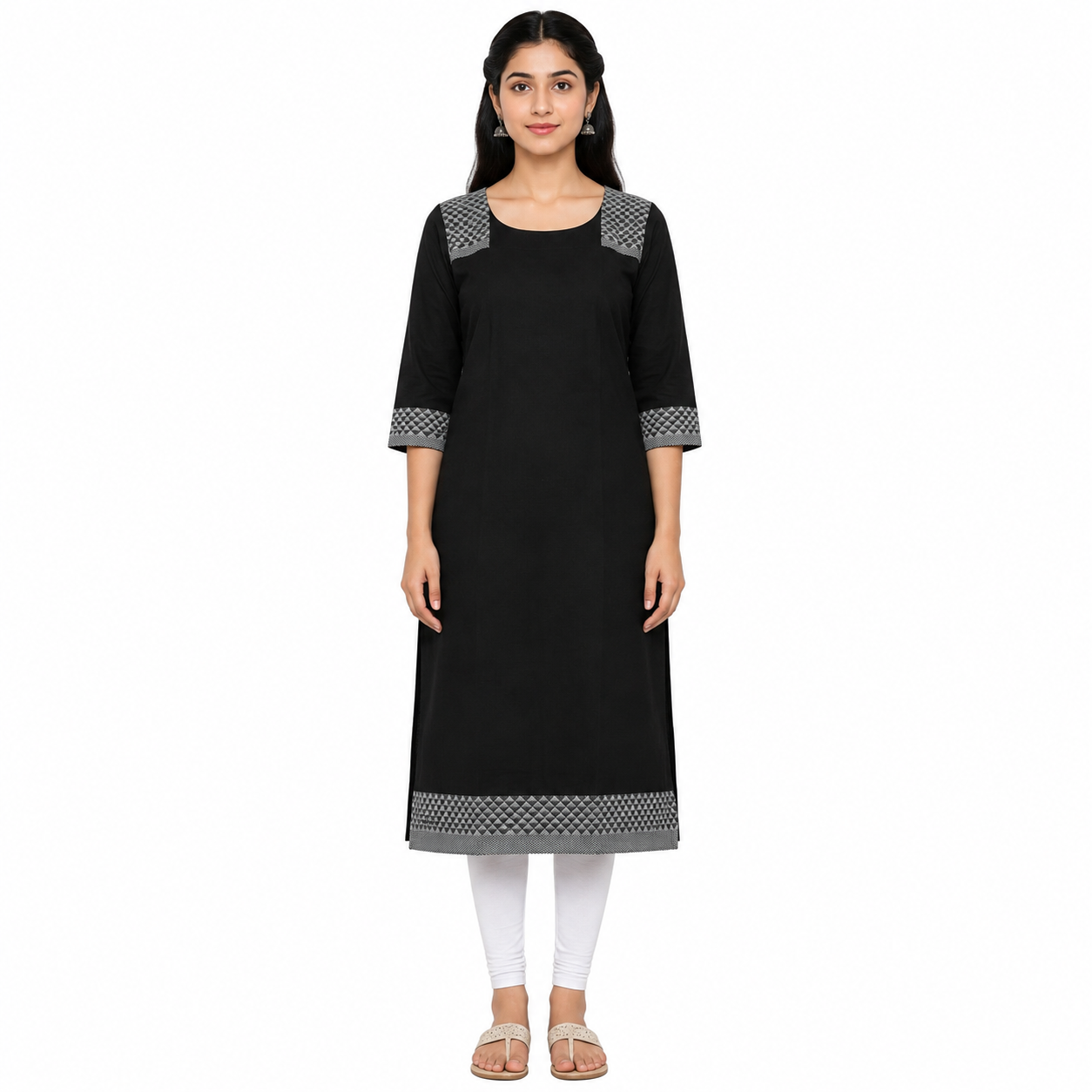 A woman modeling a black three-quarter sleeve kurta with gray and white patterned trim at the neckline, cuffs, and hem, paired with white leggings and beige flat sandals against a plain white background.