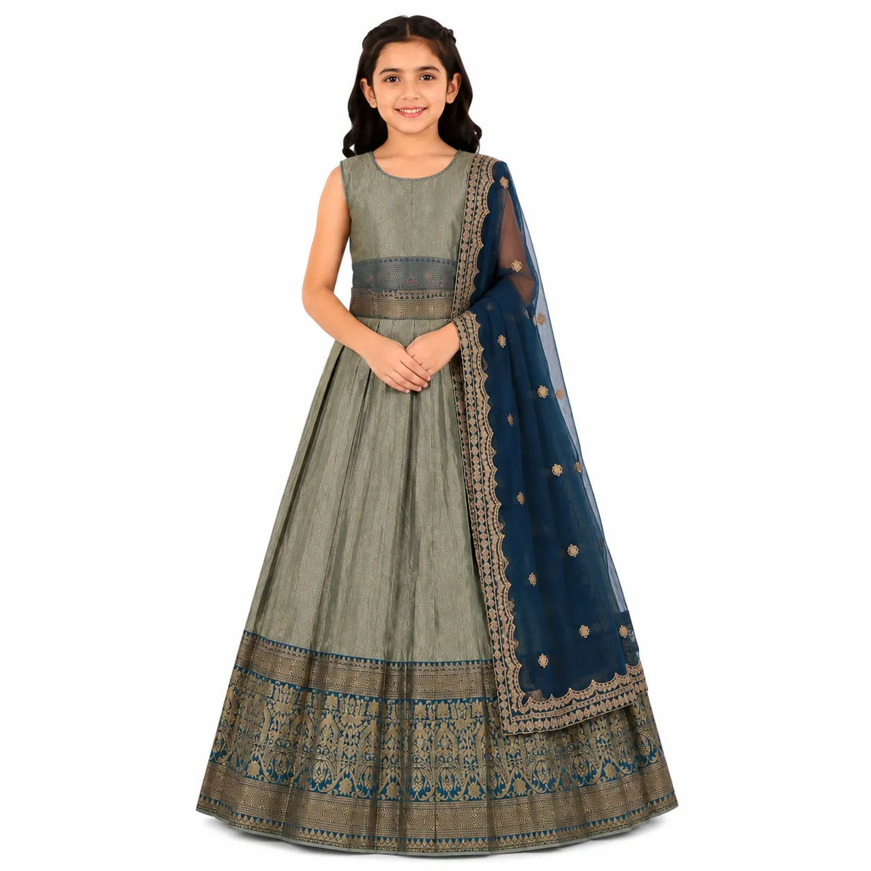 A young girl modeling a traditional Indian outfit consisting of a sleeveless olive green flared skirt (lehenga) with a detailed gold and blue border, a matching green sleeveless top, and a navy blue dupatta with gold embroidery.