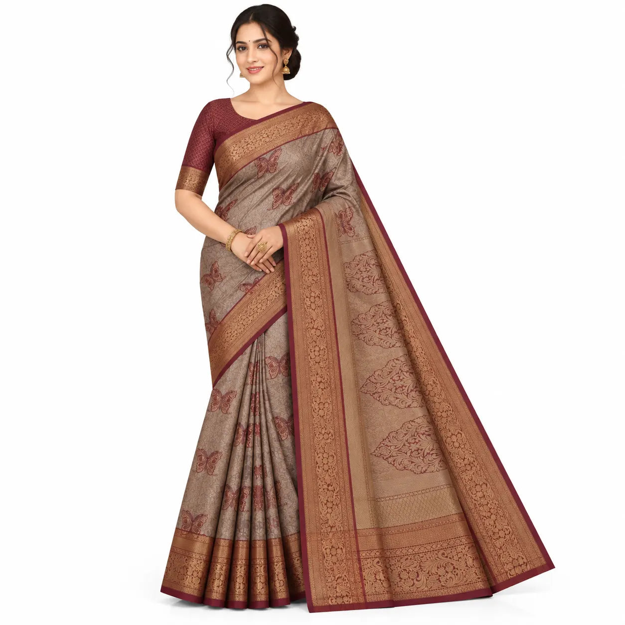 A woman modeling a traditional Indian saree with a beige body, deep red border, and intricate gold and red floral patterns, set against a plain white background.