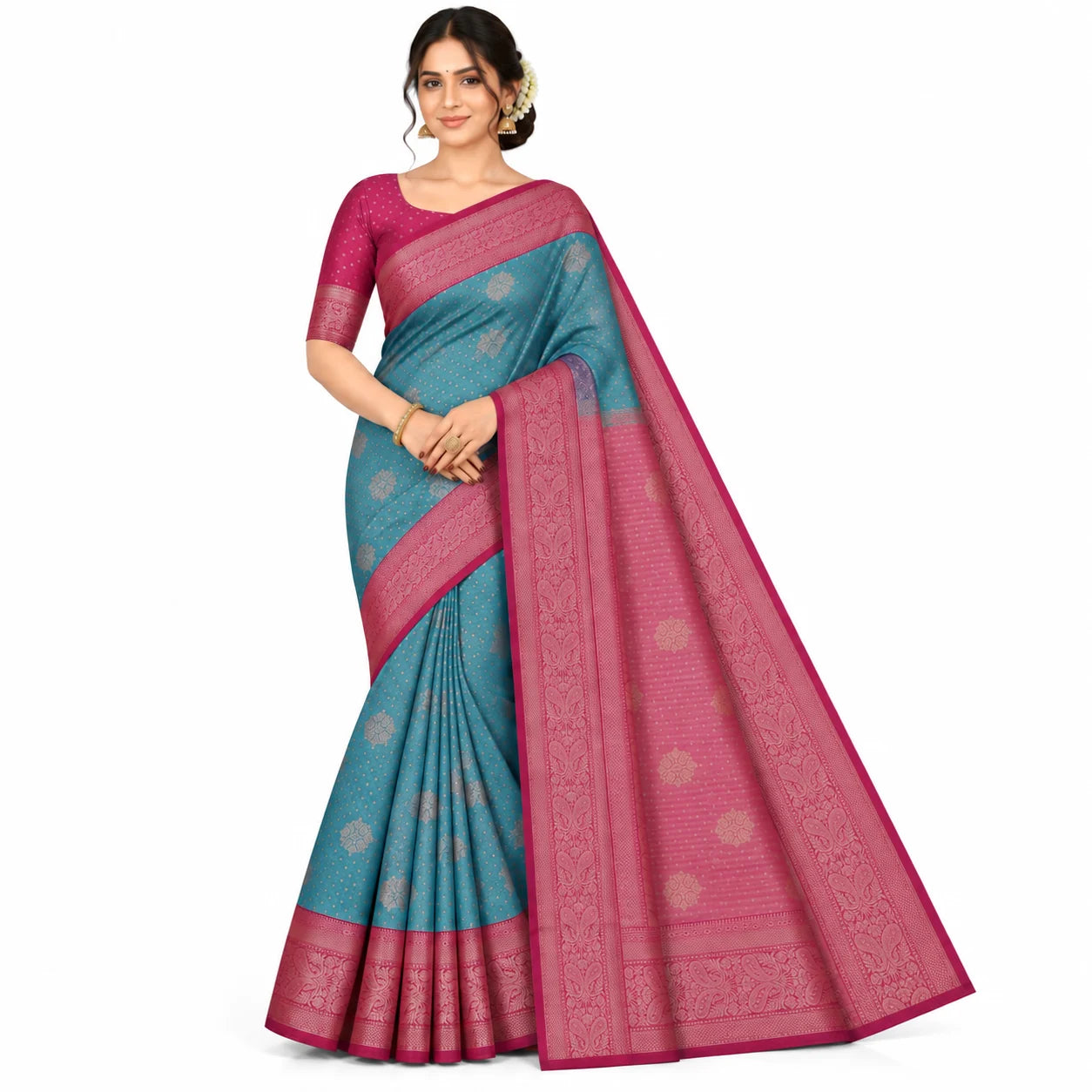 A woman modeling a teal blue and magenta pink saree with gold floral motifs and a matching pink blouse, set against a plain white background.