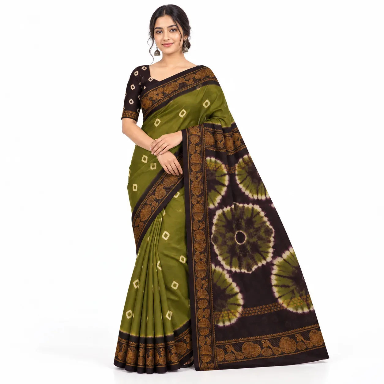 A woman modeling a green and brown tie-dye saree with a black blouse against a plain white background.