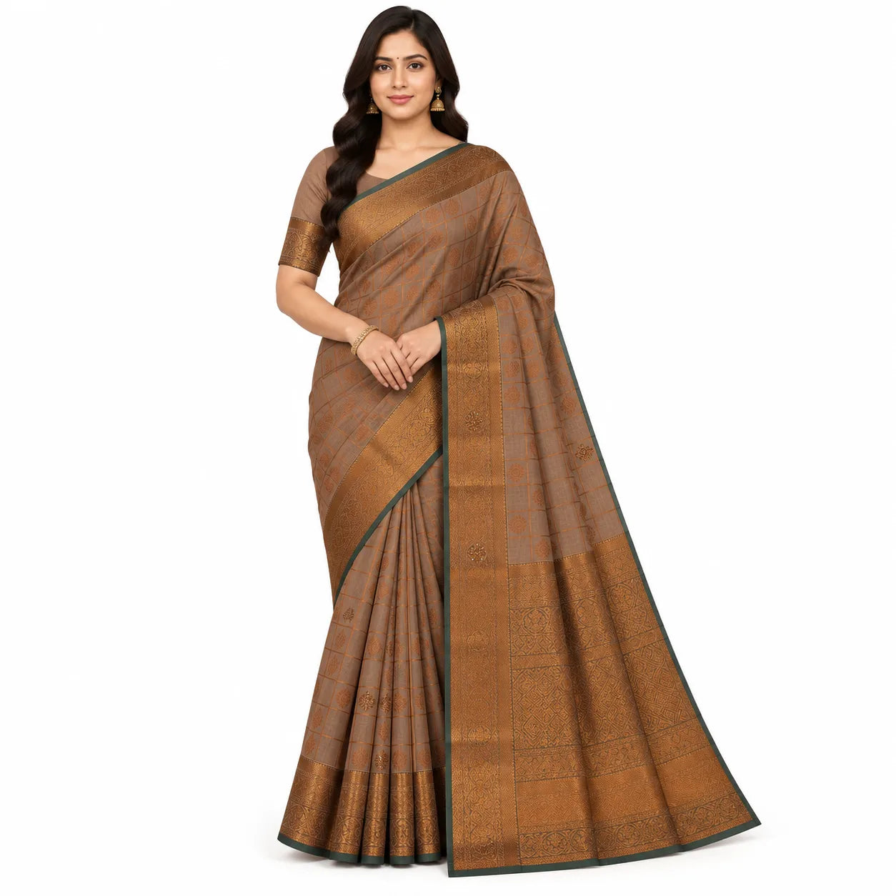 A woman modeling a brown and gold patterned silk saree with a dark green border, paired with a matching brown blouse, set against a plain white background.
