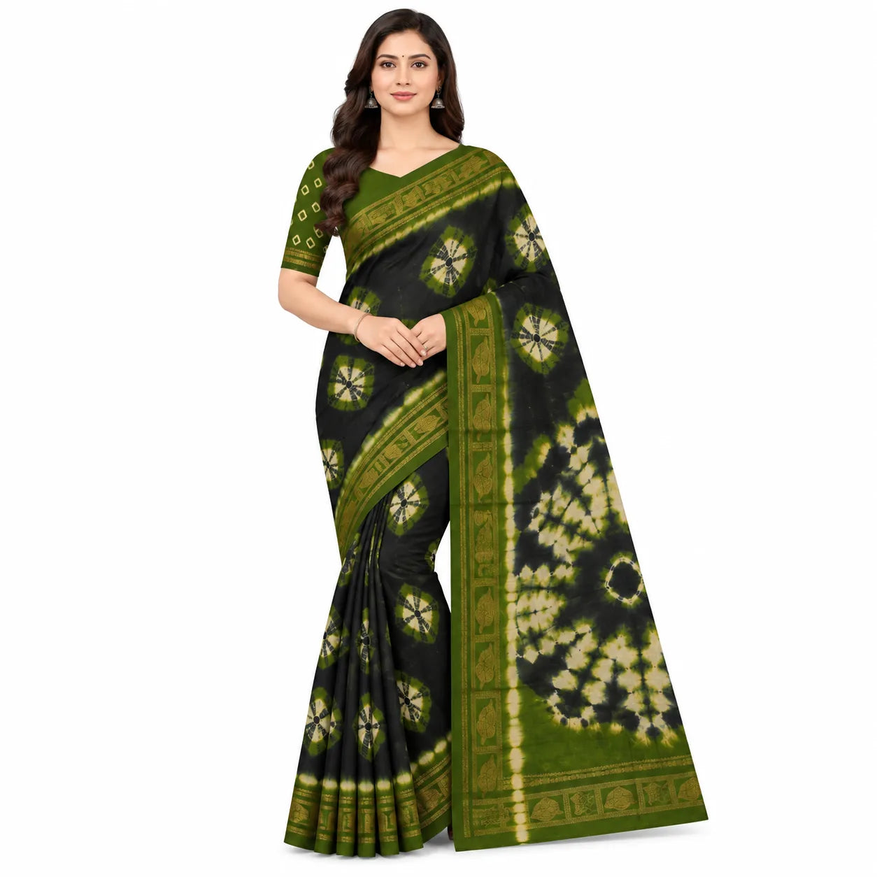 A woman modeling a black and olive green saree with beige tie-dye patterns and a green border, set against a plain white background.