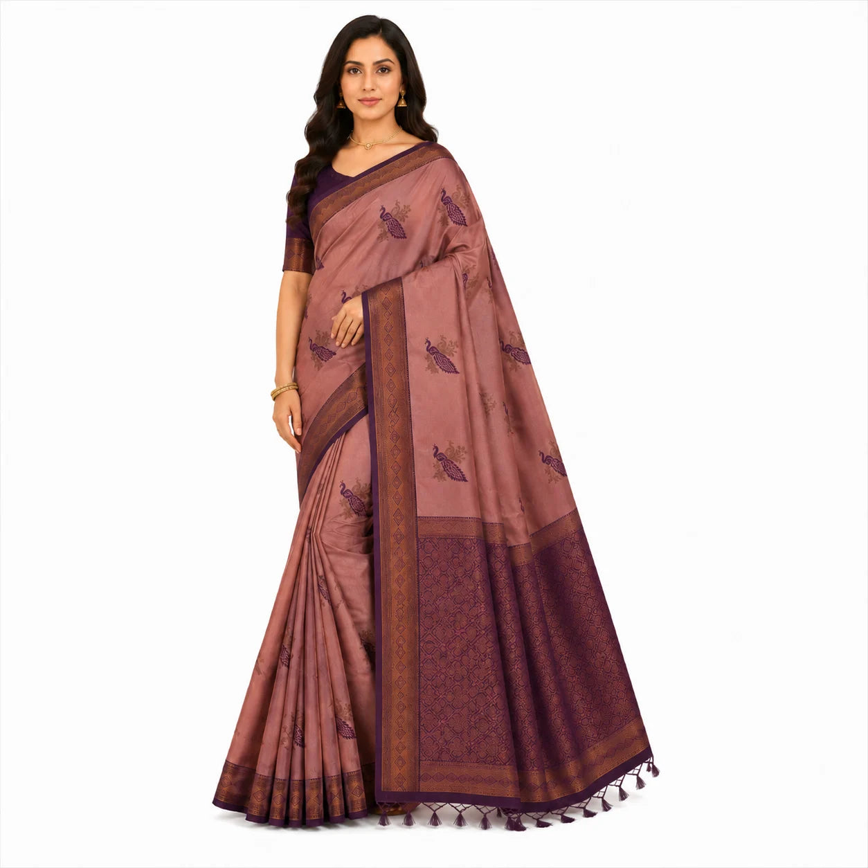 A woman modeling a dusty rose and deep purple silk saree with butterfly motifs and a wide border, set against a plain white background.