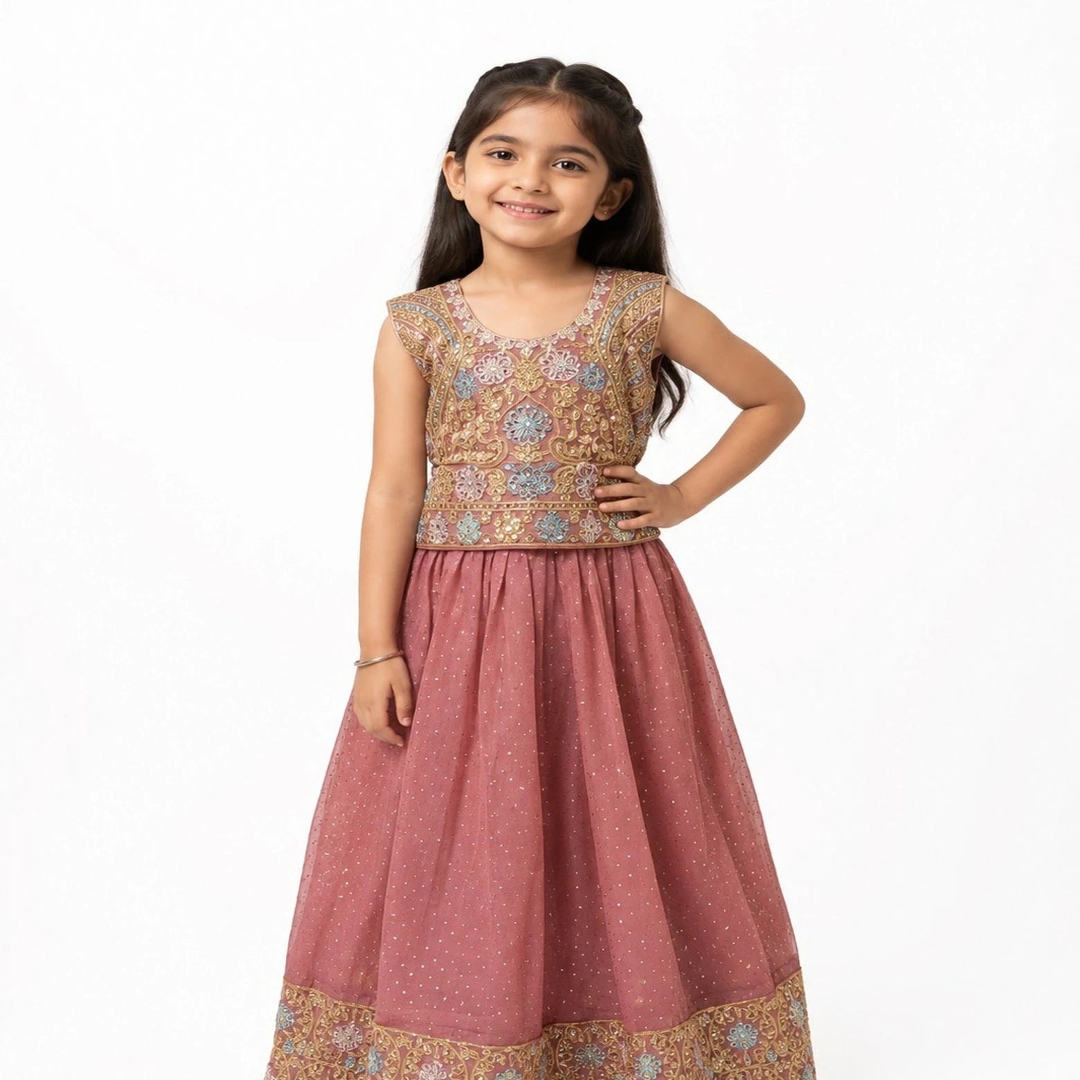 A young girl modeling a sleeveless dusty rose pink Anarkali-style dress with a heavily embroidered gold, beige, and blue floral bodice and a matching embroidered border on the skirt, set against a plain white background.