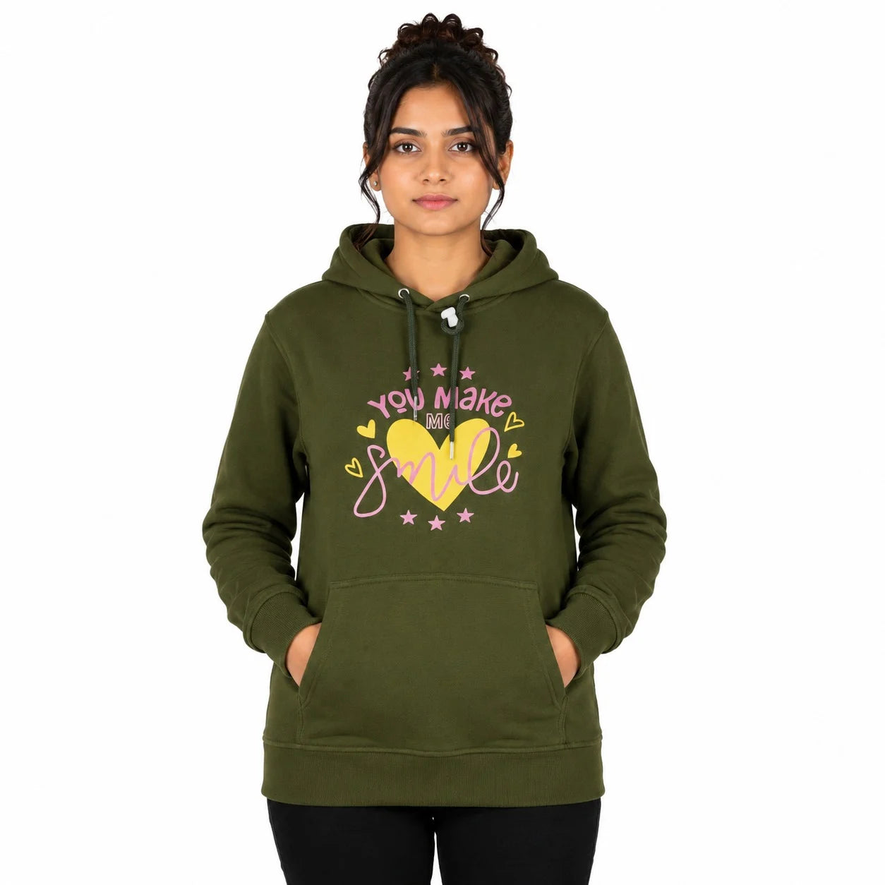 A woman modeling an olive green pullover hoodie with a graphic on the front that reads 'you make my smile' in pink and yellow lettering with a yellow heart. The background is solid white.