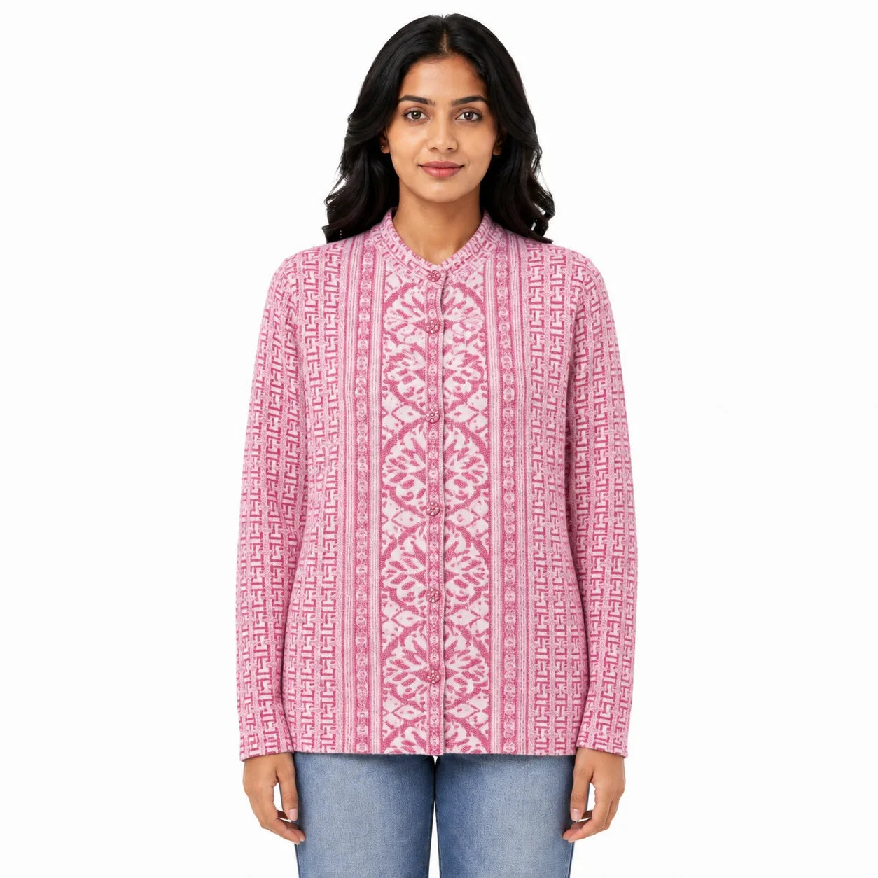 A woman modeling a pink long-sleeve button-up shirt with a white geometric and floral pattern, paired with blue jeans, against a plain white background.