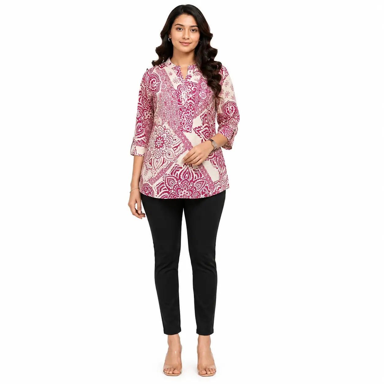 A woman modeling a pink and white patterned kurta with three-quarter sleeves, paired with black pants, against a plain white background.