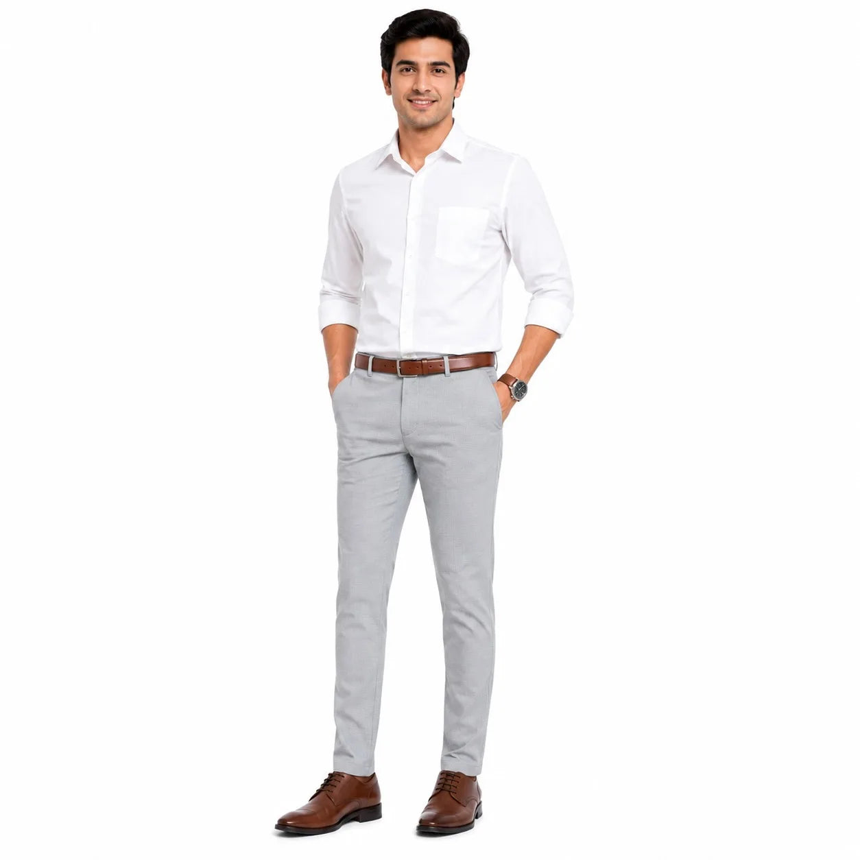 A man modeling a white long-sleeve button-down shirt, light gray trousers, a brown belt, and brown dress shoes against a plain white background.