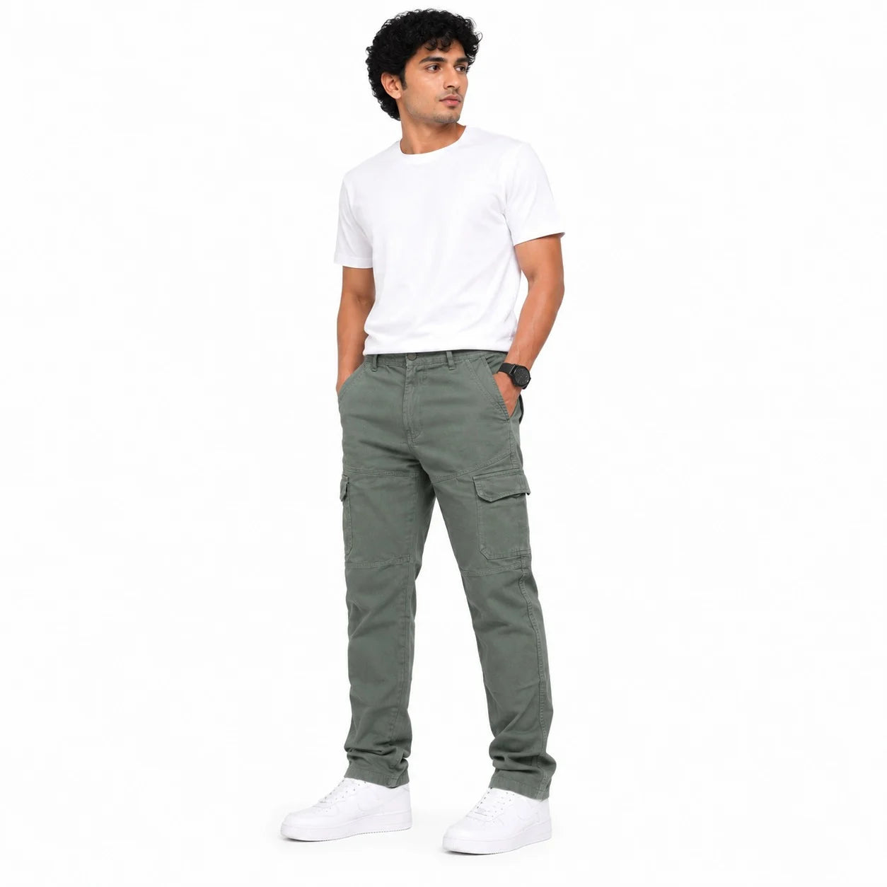 A man wearing olive green cargo pants, a white t-shirt, and white sneakers, standing against a solid white background.