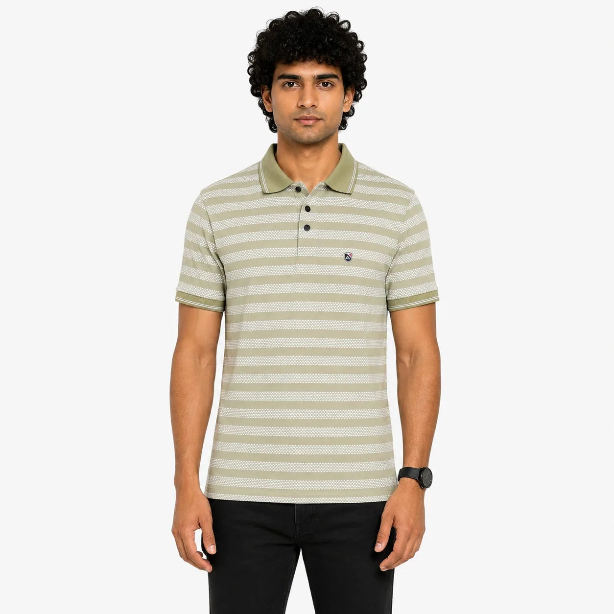 A man wearing a short-sleeve polo shirt with horizontal olive green and beige stripes, paired with black pants, standing against a light gray background.