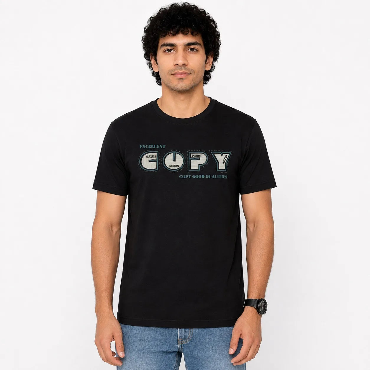 A man wearing a black short-sleeve t-shirt with a graphic print on the chest that reads 'EXPERT COPY' in a stylized font, paired with blue jeans, standing against a plain white background.