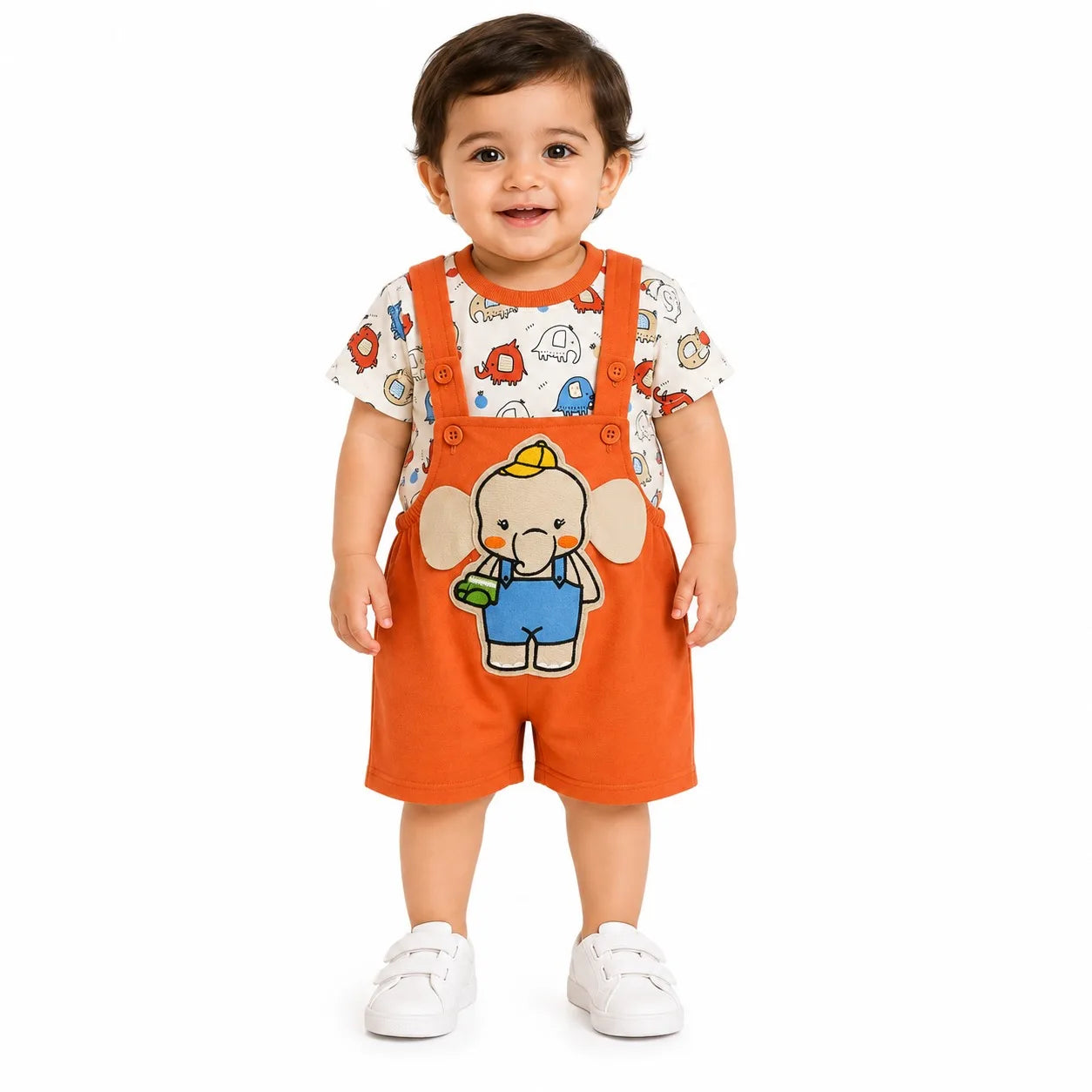 A toddler standing against a white background wearing a two-piece outfit consisting of bright orange bib shorts and a white short-sleeve t-shirt with colorful cartoon animal prints. The bib shorts feature a large cartoon elephant character printed on the front.