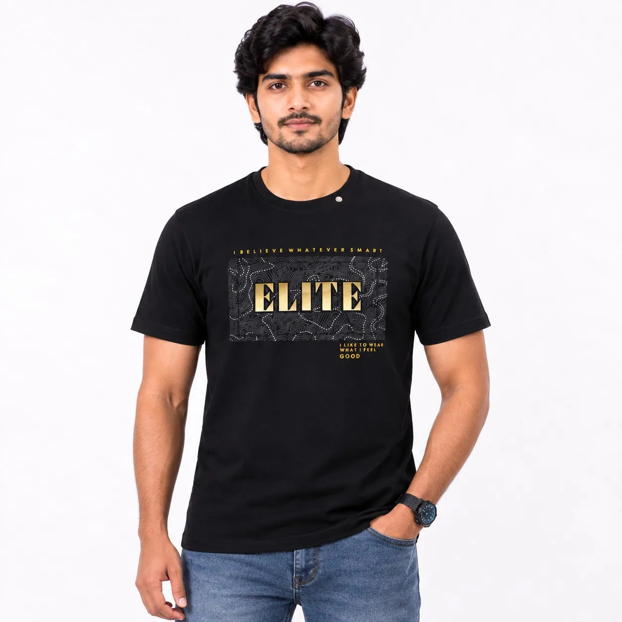 A man wearing a black short-sleeve graphic t-shirt with a gold and gray 'ELITE' print on the front, paired with blue jeans, against a plain white background.